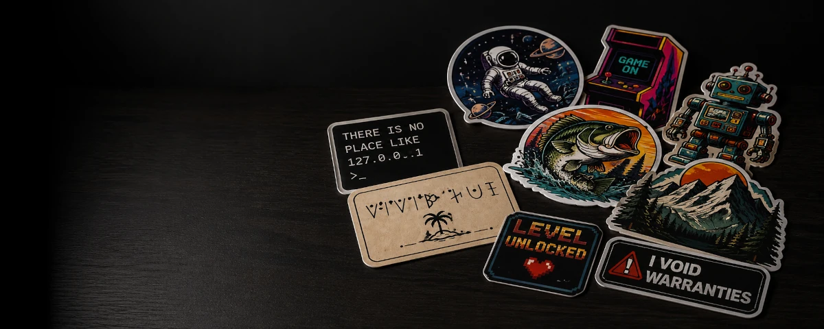 Collection of colourful custom vinyl stickers arranged on a dark surface.